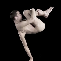 man holding his legs while a morphed arm holds him up